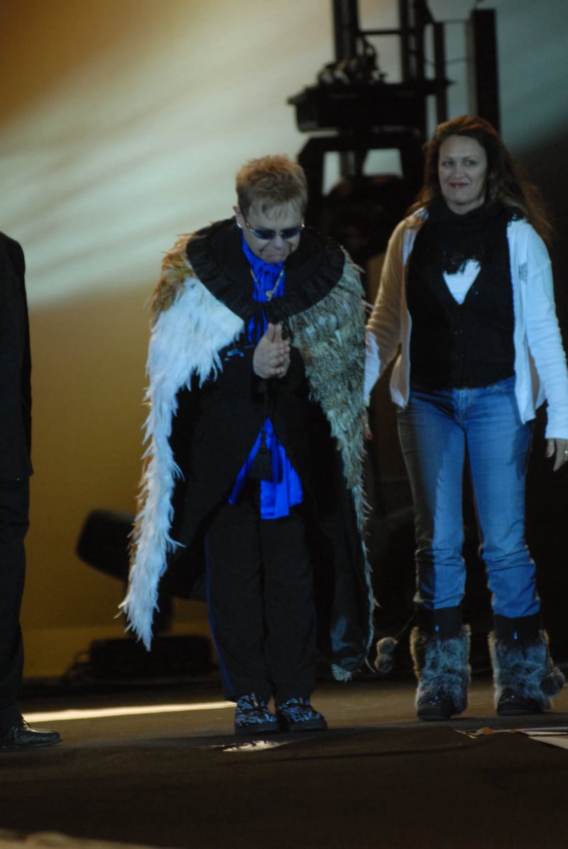 Elton John wearing a korowai during an on-stage presentation by Te Āti Awa at Bowl of Brooklands in New Plymouth.